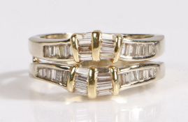 An 14 carat white gold and diamond double eternity ring, with two rows of baguette cut diamonds,