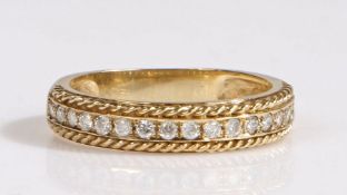9 carat gold and diamond half-hoop eternity ring, having an elegant line of  diamonds set within