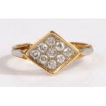 A 18 carat gold and diamond ring, the head set with nine round cut diamonds approx 0.05 carat,