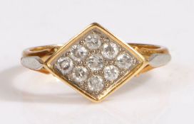 A 18 carat gold and diamond ring, the head set with nine round cut diamonds approx 0.05 carat,