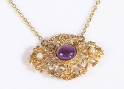 A 9 carat gold pendant and necklace, the pendant set with a cabochon cut amethyst together with