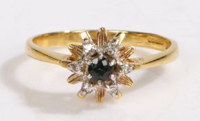 An 18ct gold sapphire and diamond ring, with a central sapphire and diamond surround forming a