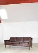 A Danish brown-leather three-seat sofa, after Borge Morgensen, 76cm high, 188cm wide