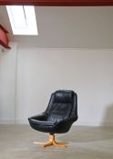 A Danish leather bucket swivel chair, 99cm high, 82cm wide