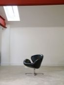 A Danish leather 'Swan' chair, after Arne Jacobsen, 74cm high, 71cm wide