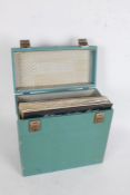 Collection of approx. 50 7" singles in a blue carrying case