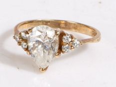 9 carat gold and paste ring, the head set with pear shaped paste stone together with three brilliant