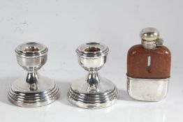 Matched pair of squat silver candlesticks, one with inscription dated 1967, small brown leather
