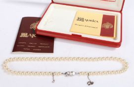A silver and pearl necklace, comprised of a single strand of well-matched cultured pearls, measuring