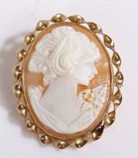 9 carat gold cameo brooch, with a gold twisted rim enclosing a cameo of a classical lady, 4.5cm high