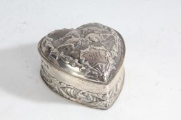 Victorian silver dressing table box and cover, of heart form, the hinged lid with embossed cherub