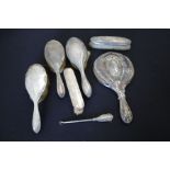 Silver handled dressing table accessories, various dates and makers, to include hand mirror, three