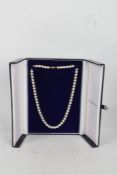 18 carat gold clasped pearl necklace, set with graduating spherical pearls, 48cm long, housed with a