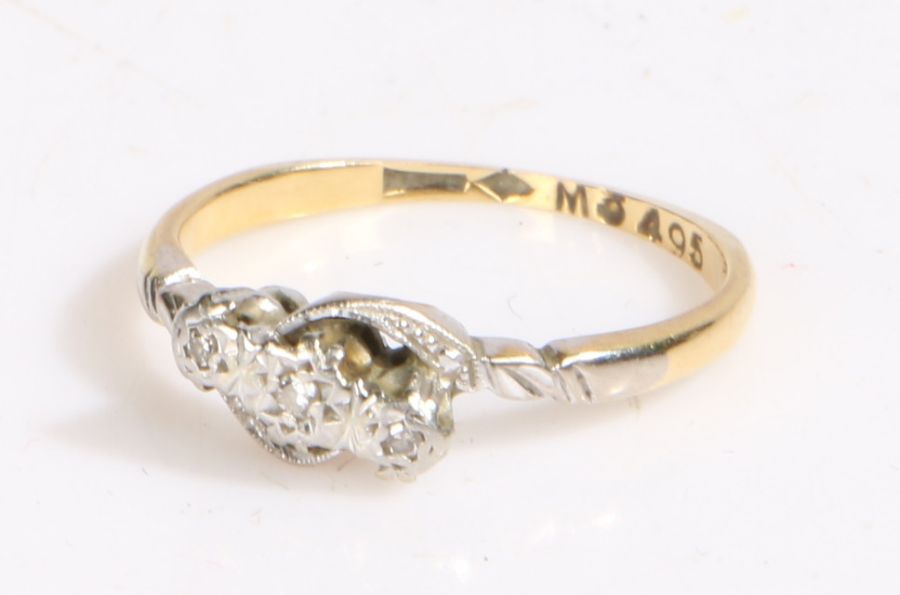 9 carat gold and diamond ring, the head set with three illusion set diamonds, ring size L weight 2.4