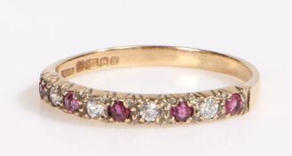 9 carat gold ruby and paste half eternity ring, the head set with alternating ruby and paste stones,