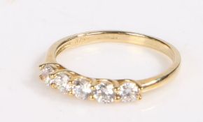 9 carat gold and paste ring, the head set with five claw mounted stones, ring size L weight 1.4