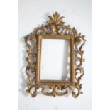 Rococo style gilt metal frame, with pierced swag border, 30cm tall together with a similar example