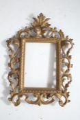 Rococo style gilt metal frame, with pierced swag border, 30cm tall together with a similar example