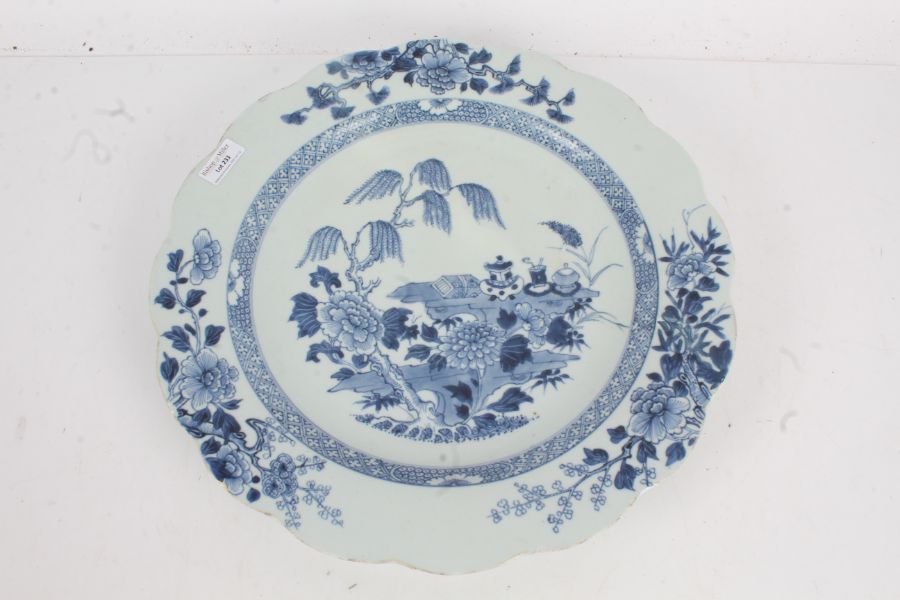 Chinese blue and white porcelain charger, the centre with a willow tree over hanging ceremonial