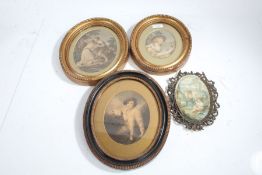 A group of four oval pictures, three 19th century etchings with hand-colouring and one silk, 180 x