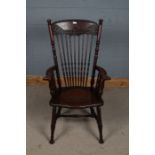 20th century arts and crafts style oak Windsor chair, with a floral carved cresting rail above