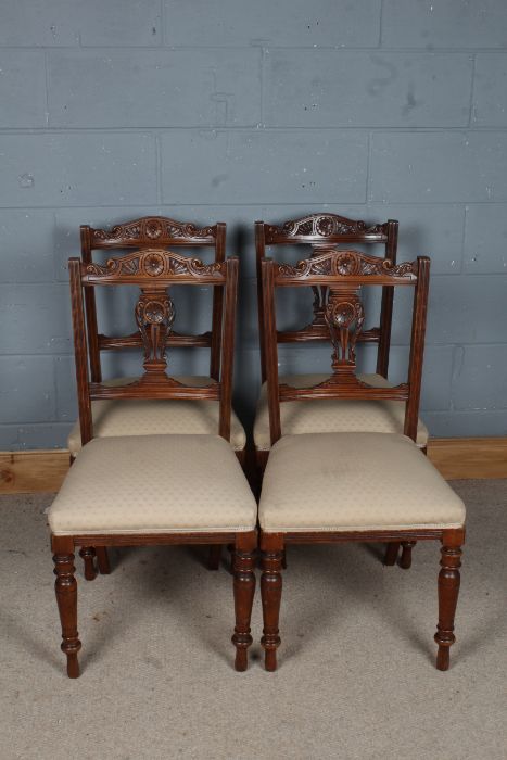 Set of four 20th century carved dining chairs, with a floral carved cresting rail together with