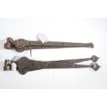 Two pairs of iron door hinges, 49.5cm and 53.5cm wide (4)