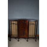 A Edwardian mahogany inlaid display cabinet having a bowfronted center section with glazed doors