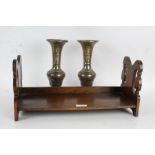 20th century oak book rack with pierced sides, together with a pair of Indian brass vases (3)