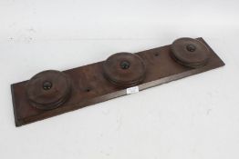 Carriage whip rack with three rotating roundels, 66cm x 14cm