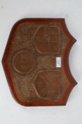 Irish copper and wooden plaque, with three coat of arms to include Dublin together with the Irish