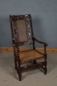 19th century Walnut and cane arm chair, the cresting rail carved with a crown and floral scenes