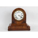 Winterhalder and Hofmeier walnut cased mantel clock, the arched case with roundel decorated plinth