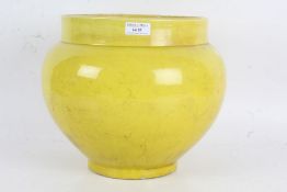 Vibrant Chinese style yellow jardiniere of bulbous form, 25cm high