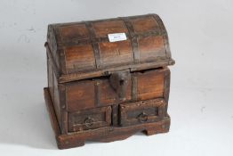 Eastern hardwood and metal bound table top chest, 20th century, the domed lid enclosing a plain