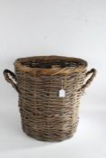 Wicker twin handle cylindrical log basket, 52.5cm high, 48cm diameter