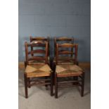 Set of four country ash ladderback chairs, three with rush seats, the other with a string seat,