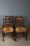 Set of four country ash ladderback chairs, three with rush seats, the other with a string seat,