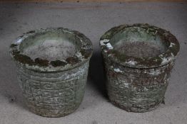 Pair of concrete garden pots, the circular top above a tapering body decorated with a repeating