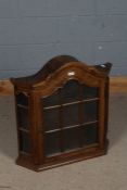 20th century oak wall cabinet, having a arched pediment above a single glazed door enclosing two