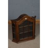 20th century oak wall cabinet, having a arched pediment above a single glazed door enclosing two