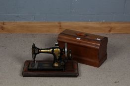 Jones Family C.S. sewing machine together with carrying case