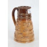 19th Century stoneware shaving mug, with raised hunting and drinking scenes, 13.5cm high