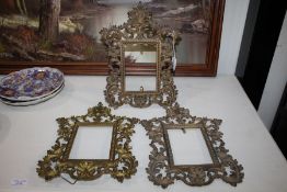 Three Rococo style gilt metal frame, with pierced scrolling and acanthus leaf border, 31cm tall