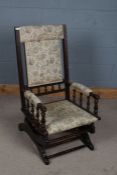 Victorian mahogany and upholstered American rocking chair, decorated with floral upholstery and