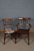 20th century elm arm chair, with unusual turned tapering supports above a pair of arms, raised on