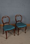 Pair of Victorian mahogany ballon back style chairs, the back decorated with floral supports, 85cm