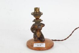 Bronzed lamp depicting Atlas set on a wooden base, 13cm high