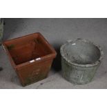 Two garden pots, one concrete example in the form of a barrel the other terracotta (2)
