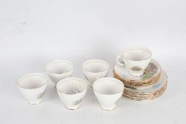 Collection of six each Royal Vale tea cups, saucers and side plates, depicting a cottage scene (